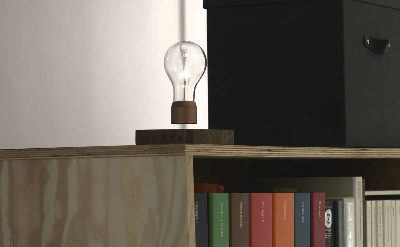 Placing the bulb on the base and releasing it slowly will see it rise and settle into position