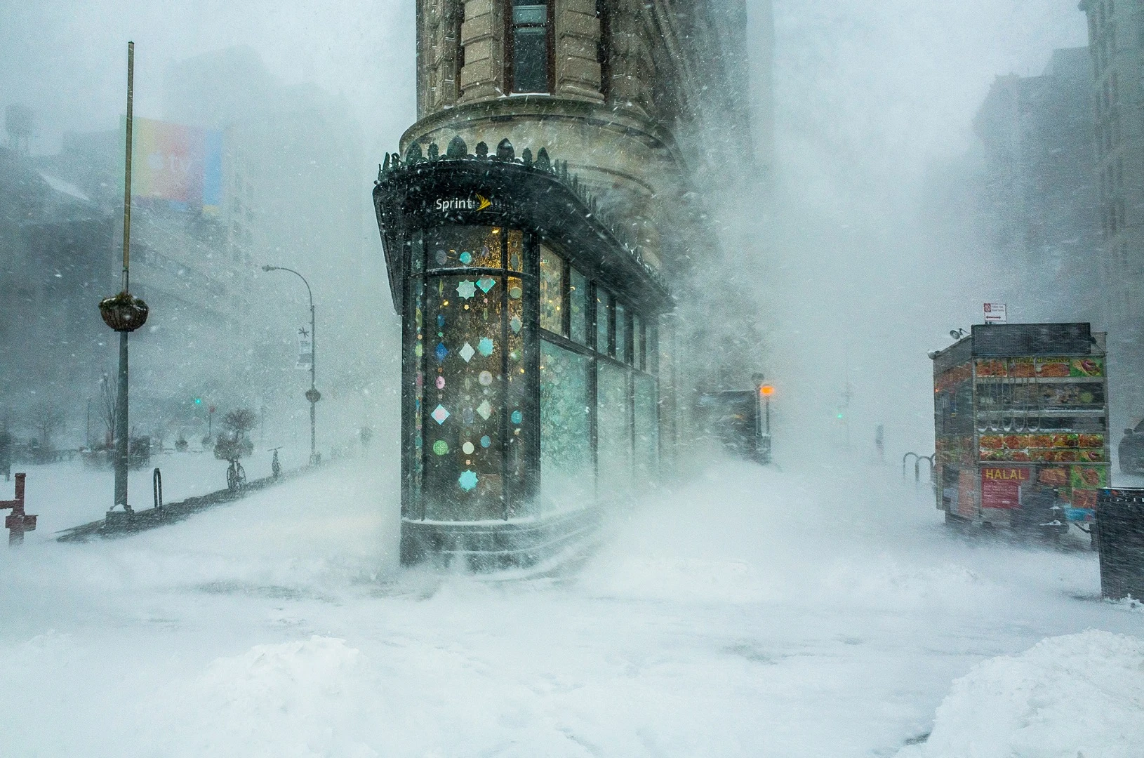 Flatiron building in a snowstorm, by Michelle Palazzo, was taken in NYC, with a Ricoh GR. "New York City’s iconic Flatiron building emerges from the blizzard like the bow of a giant ship plowing through the wind and the snow. Taken during the historic coastal storm 'Jonas' on January 23rd, 2016 the photograph went viral during the aftermath of the storm," says the photographer