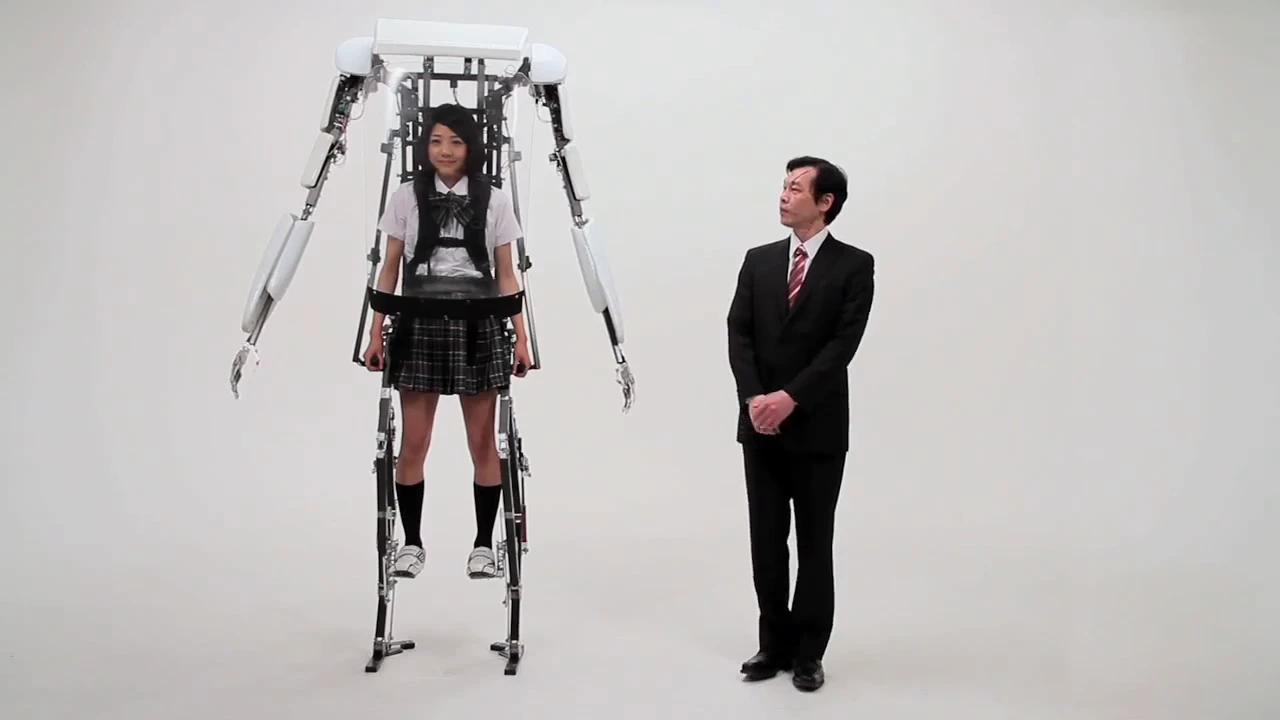 A school girl wearing Sagawa Electronics' Power Jacket MK3 stands above a grown man