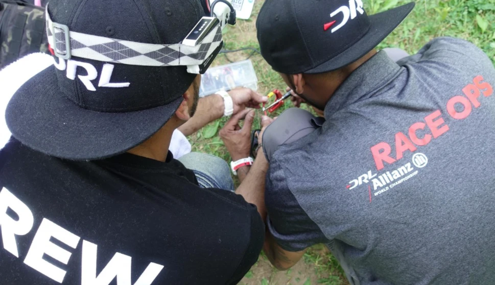 Engineers tinker with the RacerX drone