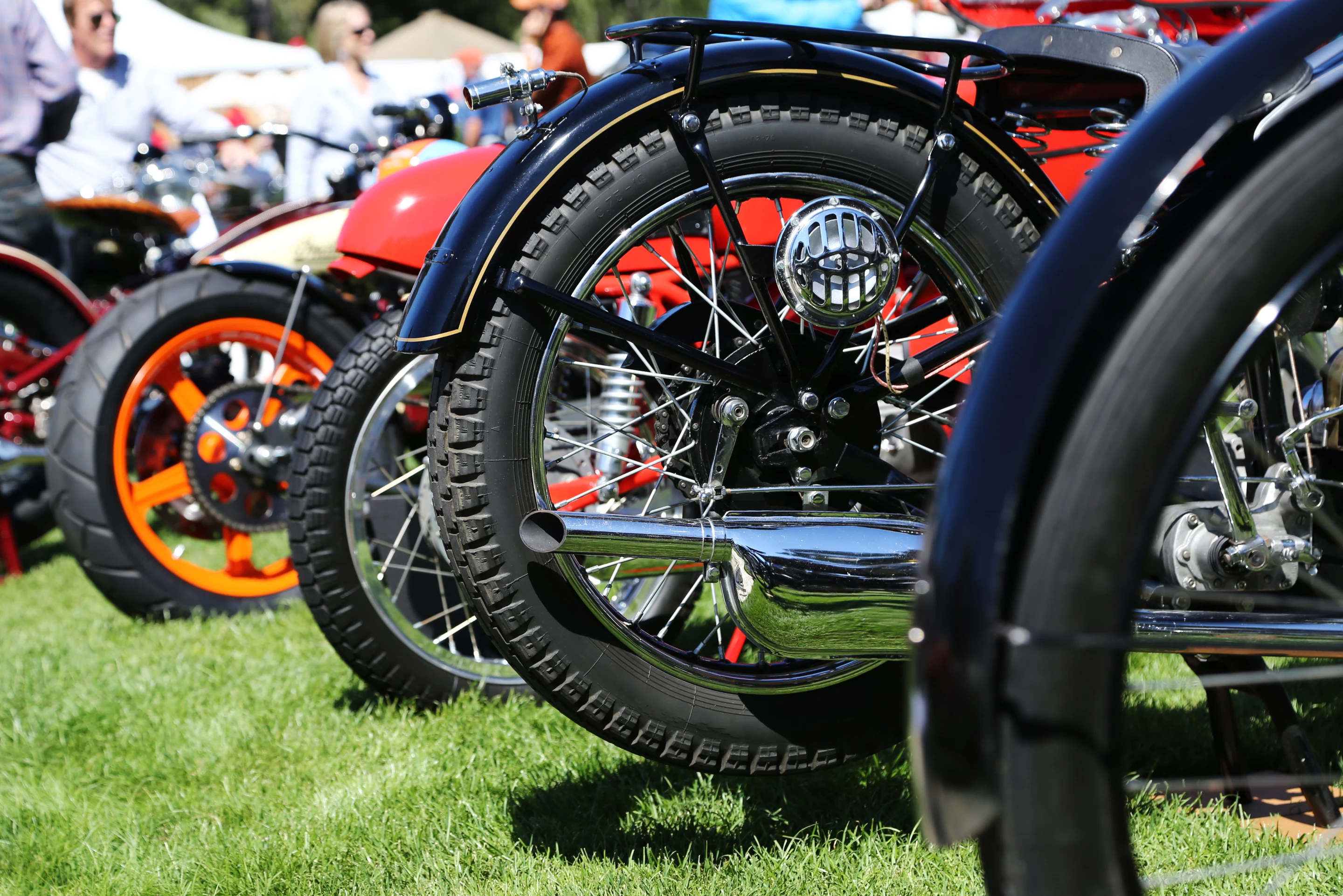 Vintage motorcycles lined up on the grass at Quail (Photo: Angus MacKenzie/Gizmag.com)