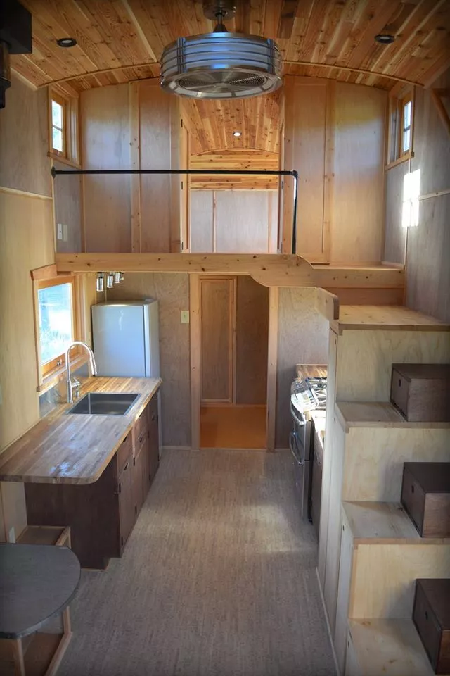 Entering via the hand-built dutch doors, visitors find a 9 x 24 ft (2.7 x 7.31 m) main floor, plus a 9 x 13 ft (2.7 x 4 m) loft