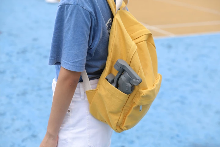 The DJI Osmo Mobile 3 can be folded down for transport in a backpack