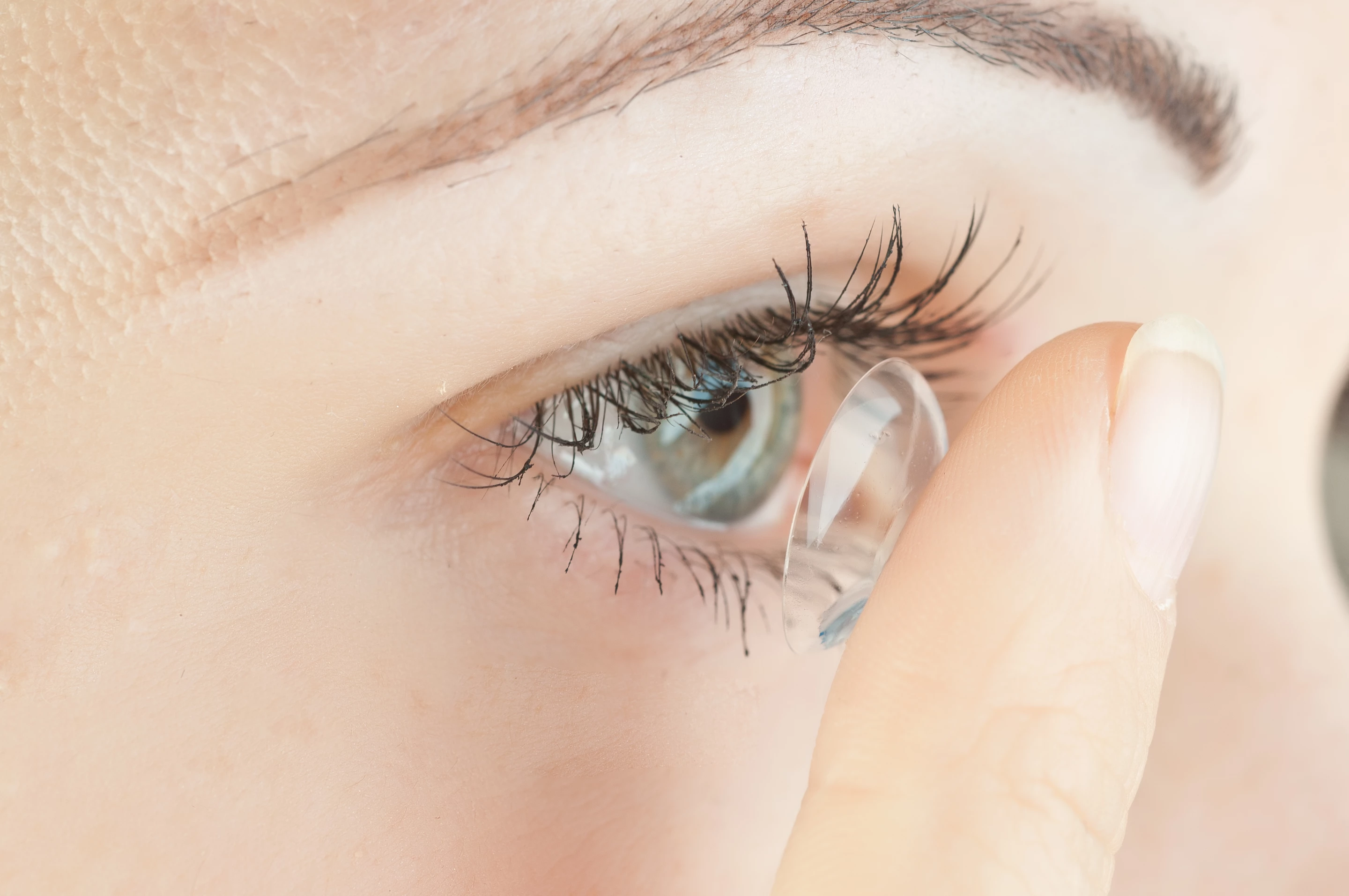Unlike a traditional contact lens such as this one, the new device might actually help keep eyes moist instead of drying them out