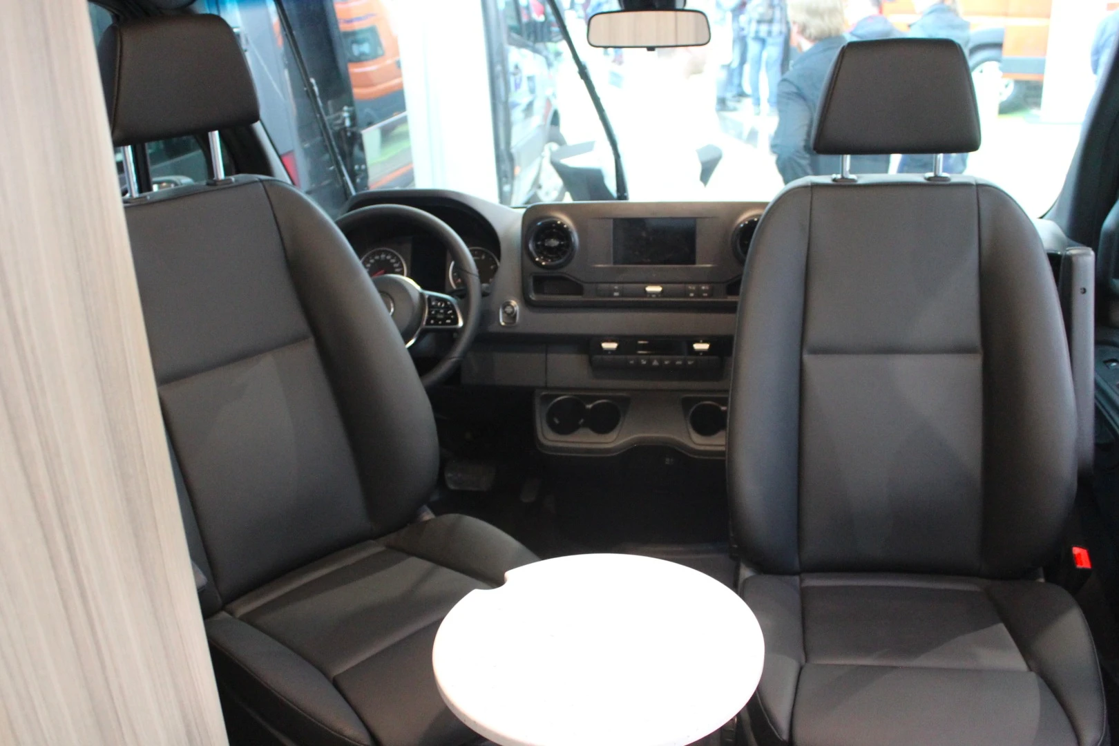 Roadtrip includes a small table between the swivel driver area seats