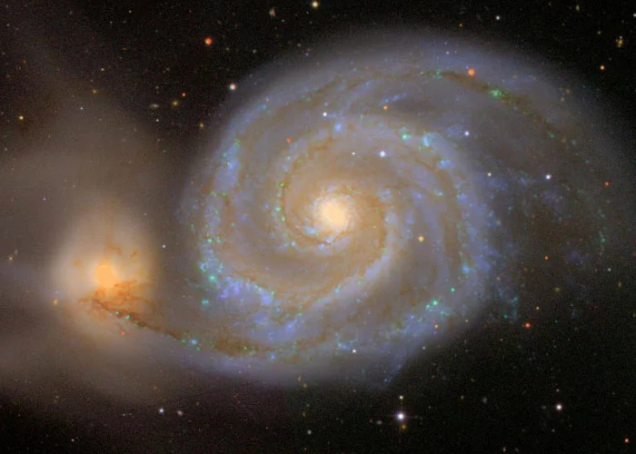 Messier 51, The Whirlpool Galaxy. The SDSS image of this famous spiral galaxy (interacting with a smaller neighbor at the lower left) occupies about three one-millionths of the total sky area imaged by the SDSS (Credit: The Sloan Digital Sky Survey)