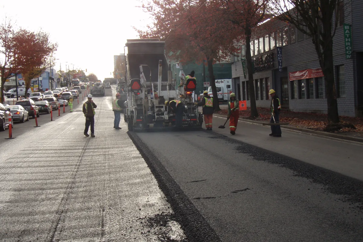 The warm mix truck laying the new asphalt mix at one of the trial locations in Vancouver