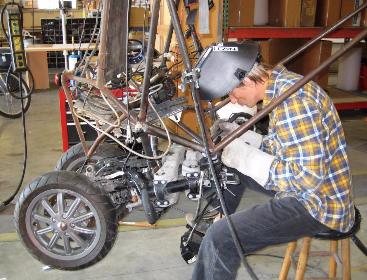 Dezso Molnar works on attaching the Piaggio MP3 front end to version 3 of the G2 Gyrocycle