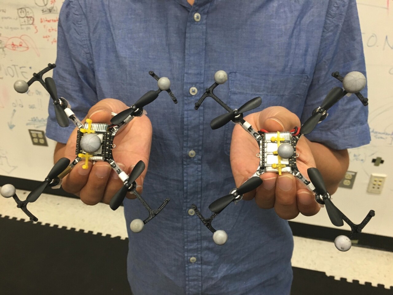 A Georgia Tech team is developing drones with "virtual top hats", allowing them to fly in formation safely