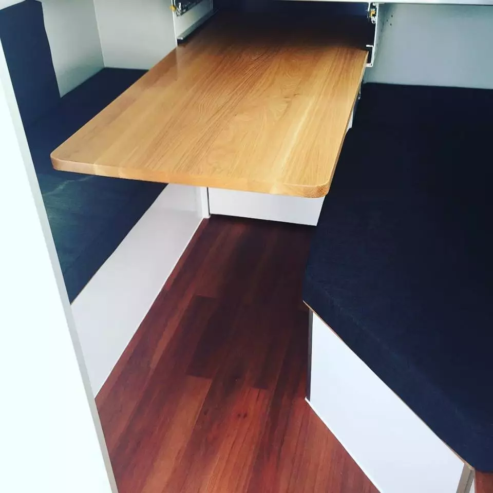 The slide-out tabletop turns the bed/benches into a dinette