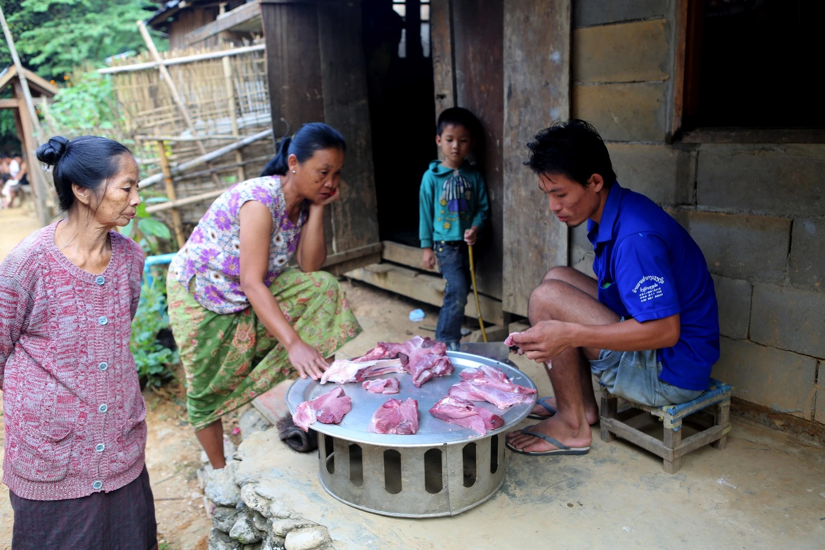 This was a wild boar until a few hours before the picture was taken. The butcher is also the village's school headmaster. Everyone came along and took their share. We got to see the whole affair, from the hunter who brought it in from the jungle, through to it hitting the plate.