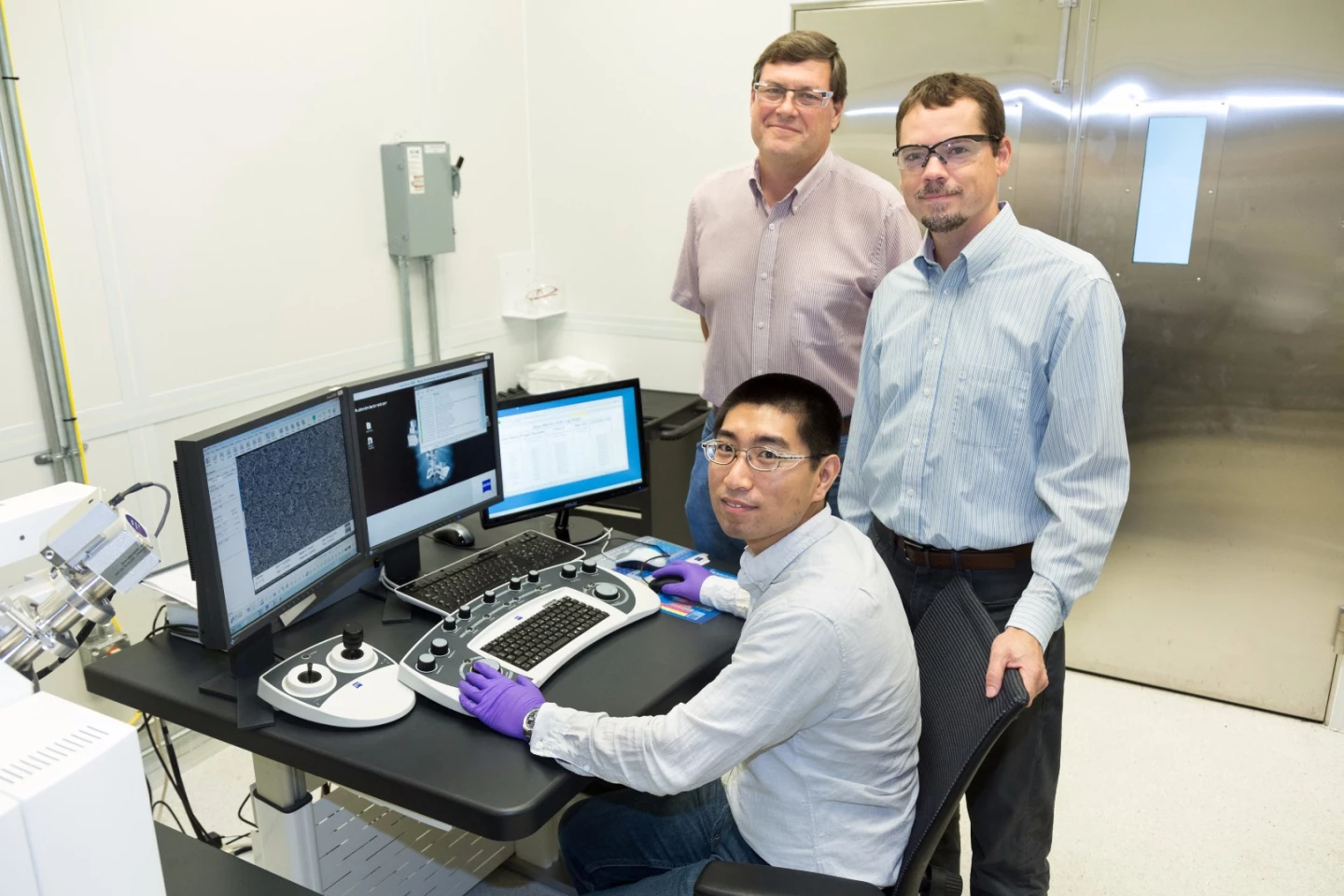 The ORNL researchers involved in the CO2-to-ethanol conversion research: Yang Song (seated), Dale Hensley (standing left) and Adam Rondinone