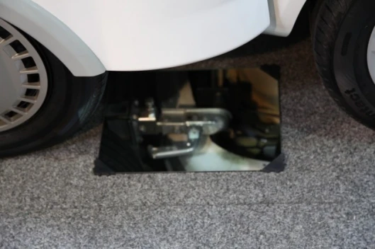 The "sideways" towbars used to connect the housing unit to the car