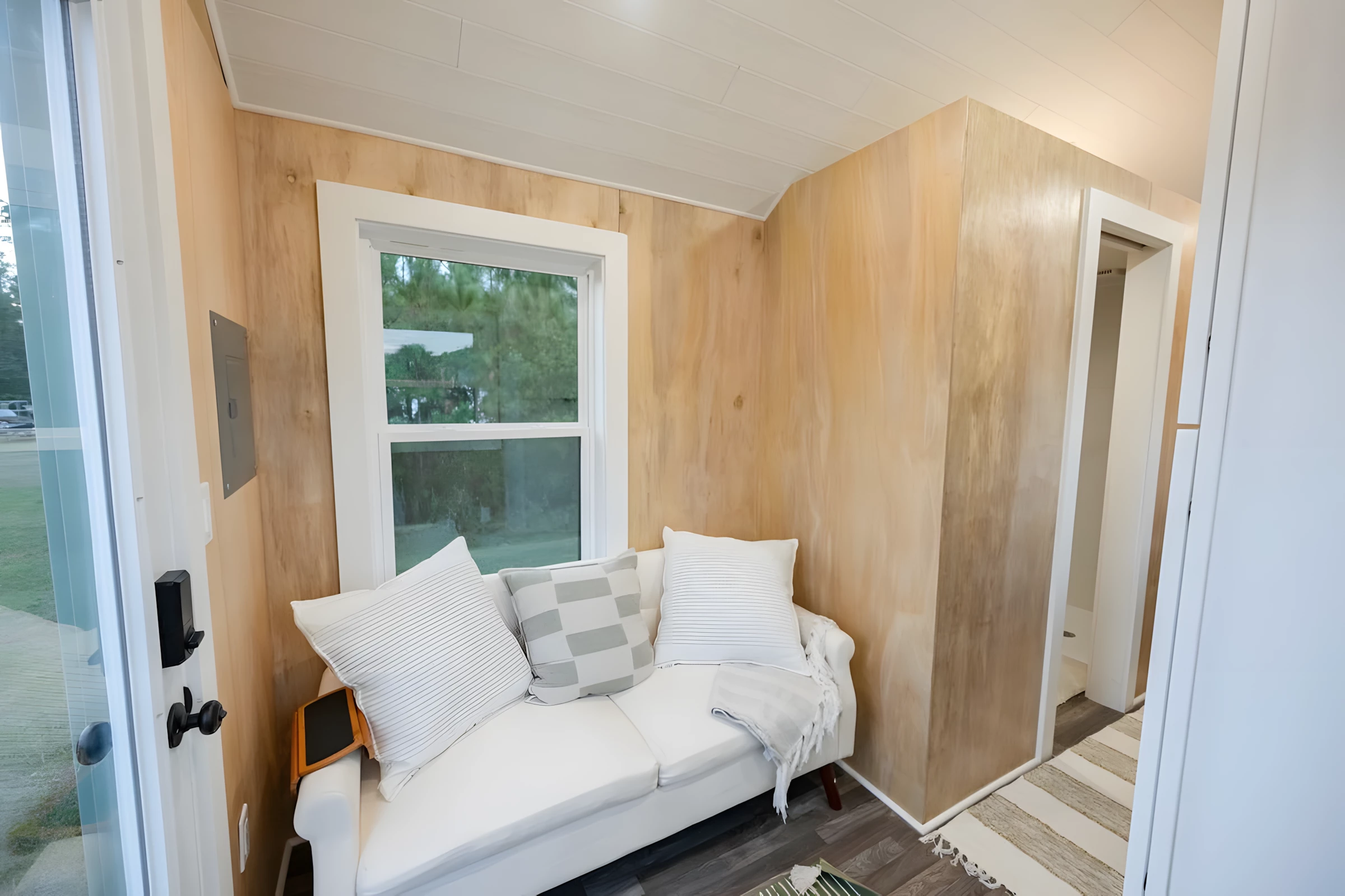 The Lad's entrance opens onto the living area, which has enough space for a sofa