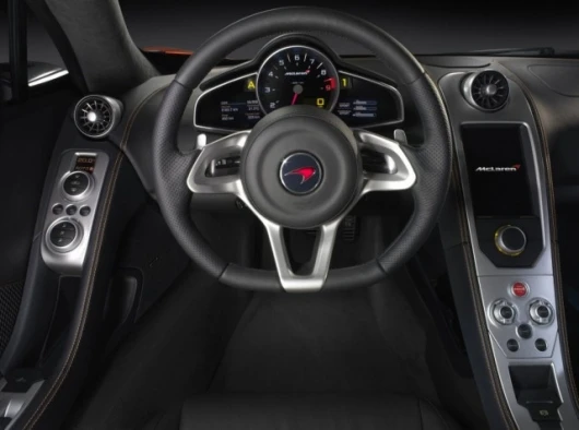 A McLaren racing-inspired steering wheel and interiors puts controls within easy reach