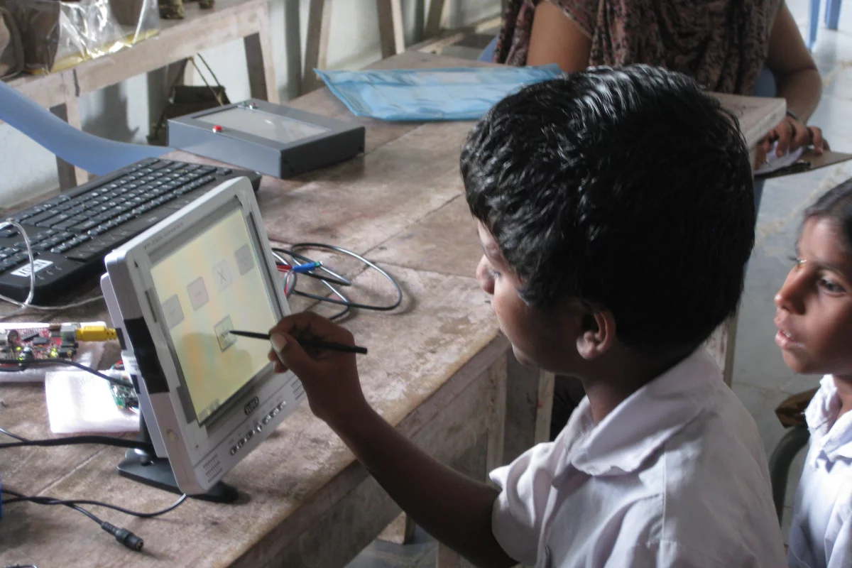An Indian student trying out a prototype of the I-slate