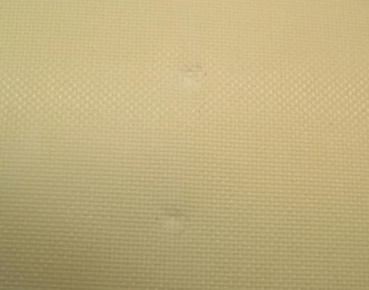 The front of Kevlar fabric soaked in STF after being shot with bullets