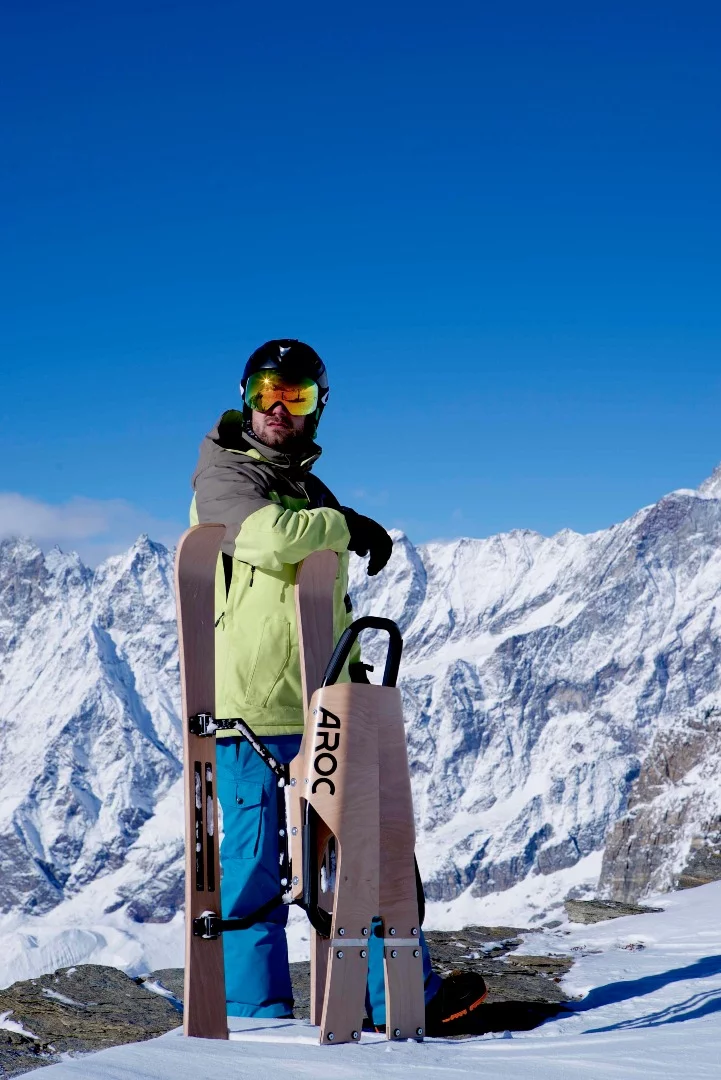 Aroc rides on wooden skis with aluminum or steel edges