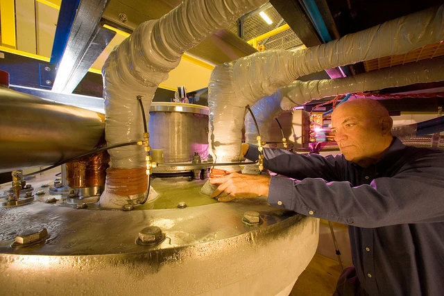 Scientist adjusting the liquid nitrogen flow to the LANL 100 Tesla pulsed magnet