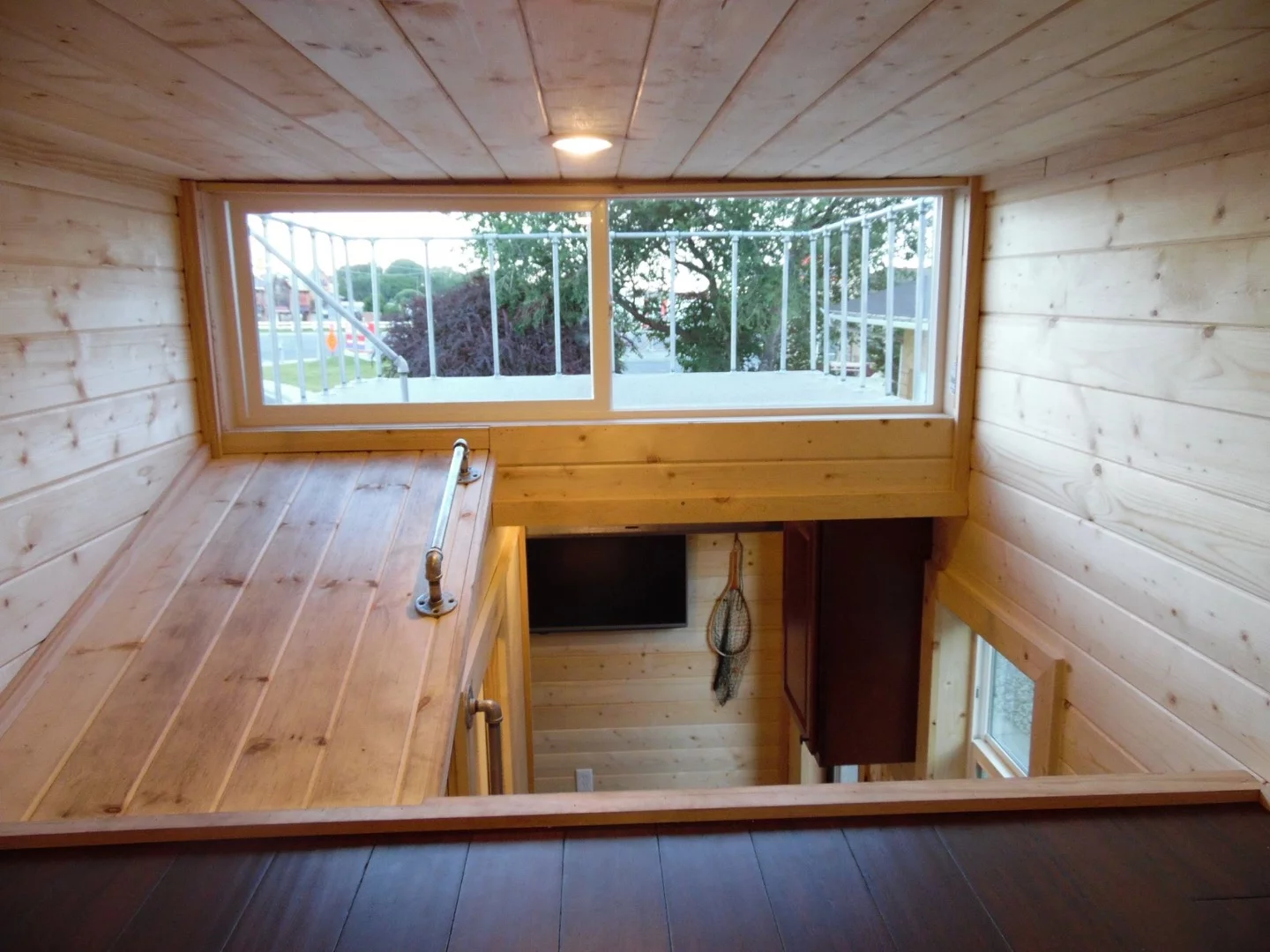 You can also access the deck from the loft, though from the photos it looks like you'd need to slide across on your stomach