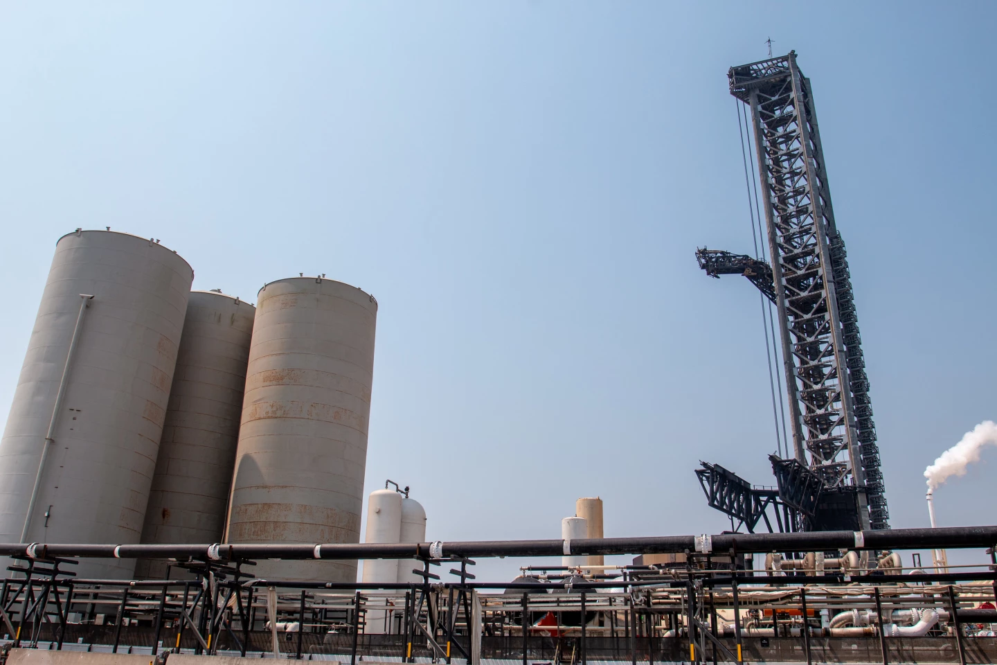 If you look at the bottom middle, those spots of orange bits dangling off the black tanks, that's the shielding that was mostly blown off into a debris field. Does anyone know what those tanks are for?