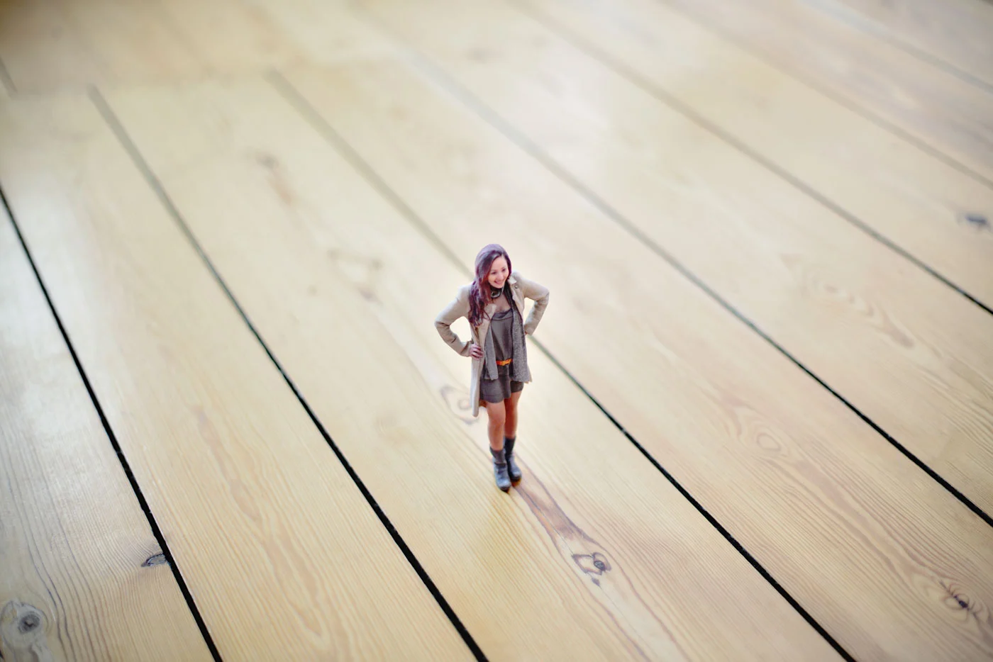 Strike a pose! A woman's 3D-printed miniature stands on floorboards