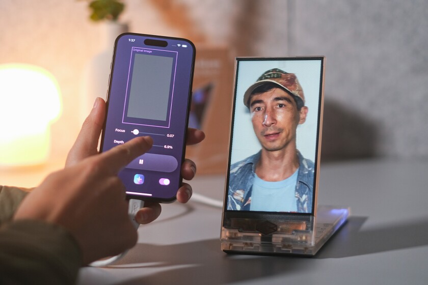 Looking Glass, known for its unique screens that showcase 3D holograms without the need for a headset or glasses, has introduced iOS support. This update allows users to view Cinematic Mode videos, custom apps, and 3D content from their iPhone or iPad directly on the display, eliminating the need for a high-powered desktop for processing.