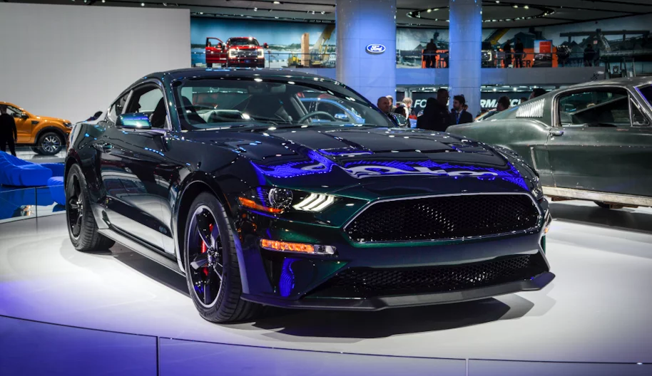 The Bullitt Mustang can be differentiated from the standard GT by the lack of badging, the Dark Highland Green paintjob, subtle chrome accents and the 19-inch torque thrust aluminum wheels