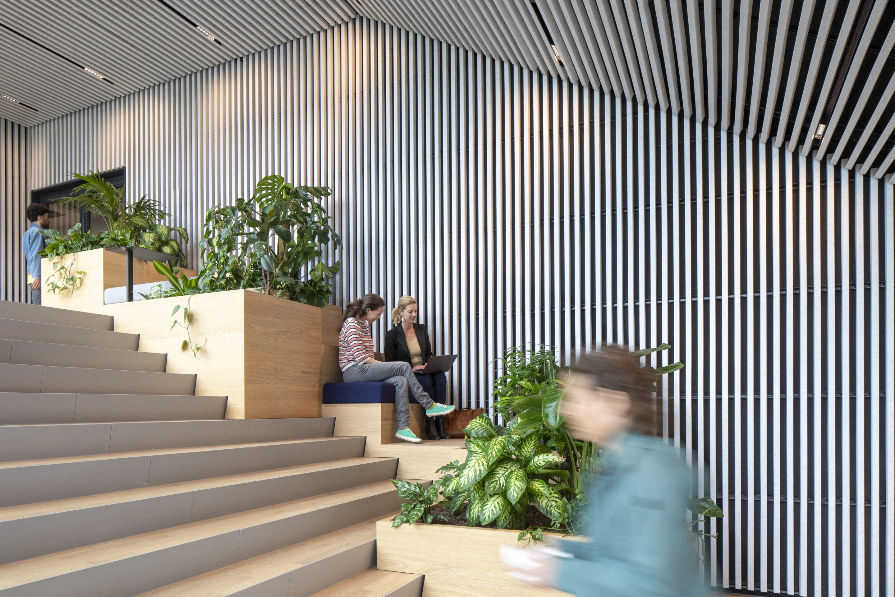 Matrix One's staircase includes tables for informal meetings and coffee areas