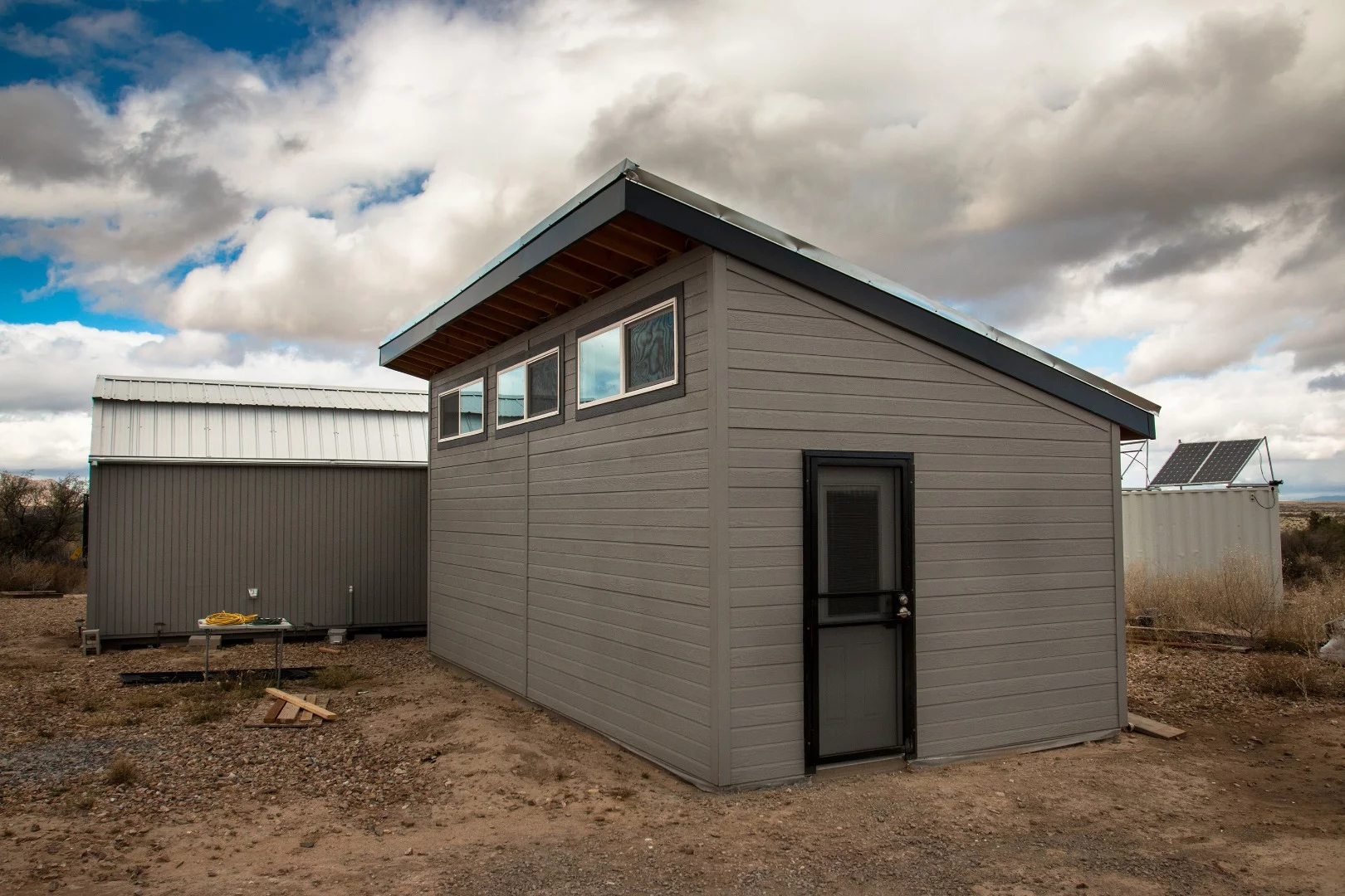 The front of the tiny home addition. Being so remote, security doors and windows help keep bad guys at bay. The high windows were purpose built so that direct sun does not enter, as the summers of the Arizona desert can produce blazingly hot days.