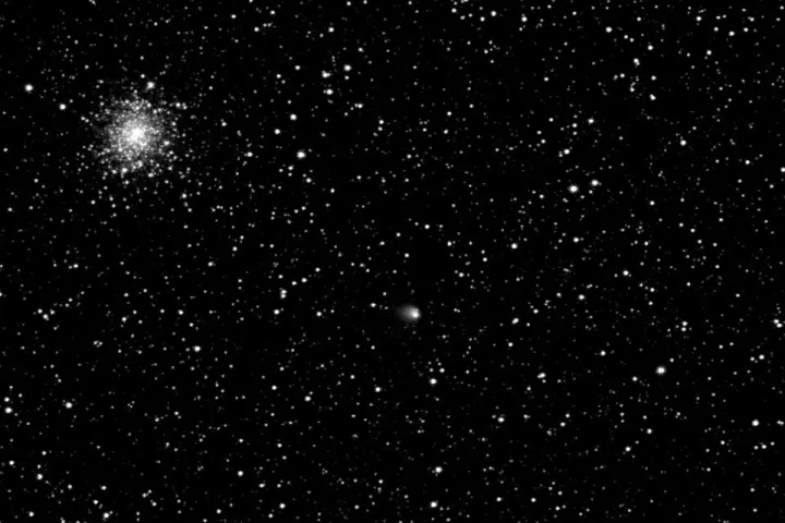 Comet 67P/Churyumov-Gerasimenko (center) against a star field (Photo: ESA/Rosetta/MPS for OSIRIS Team MPS/UPD/LAM/IAA/SSO/INTA/UPM/DASP/IDA)
