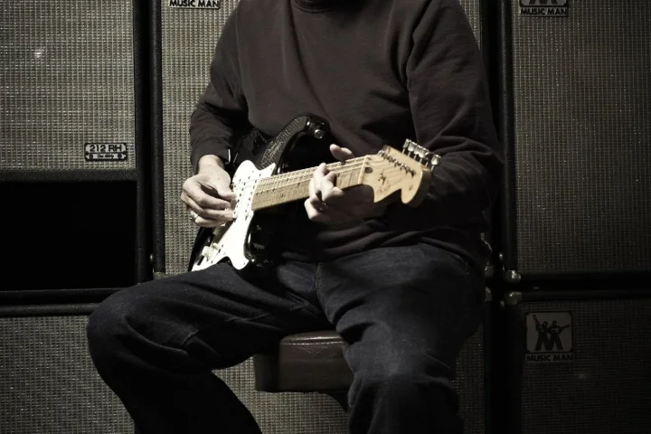 Eric Clapton with a signed 2006 'Blackie' recreation Stratocaster, estimated at between US$20,000 and US$30,000 (Credit: Original photo by Jack English, Marshbrook Limited 2010)