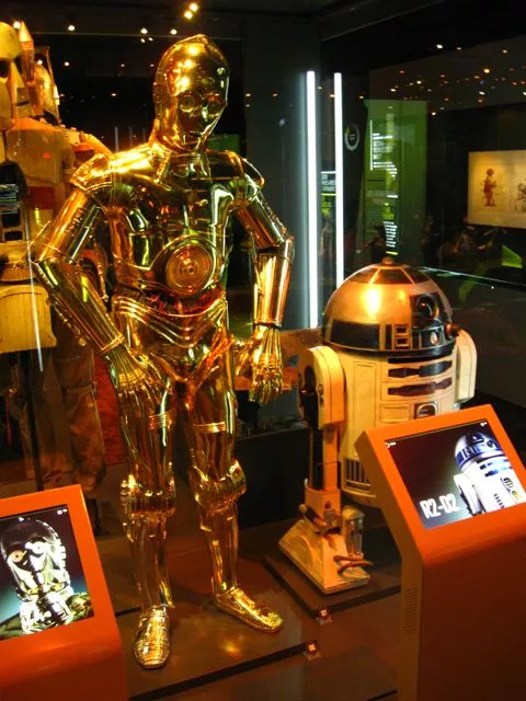 The C-3PO costume as worn by Anthony Daniels in Revenge of the Sith and the R2-D2 costume as worn by Kenny Baker in A New Hope
