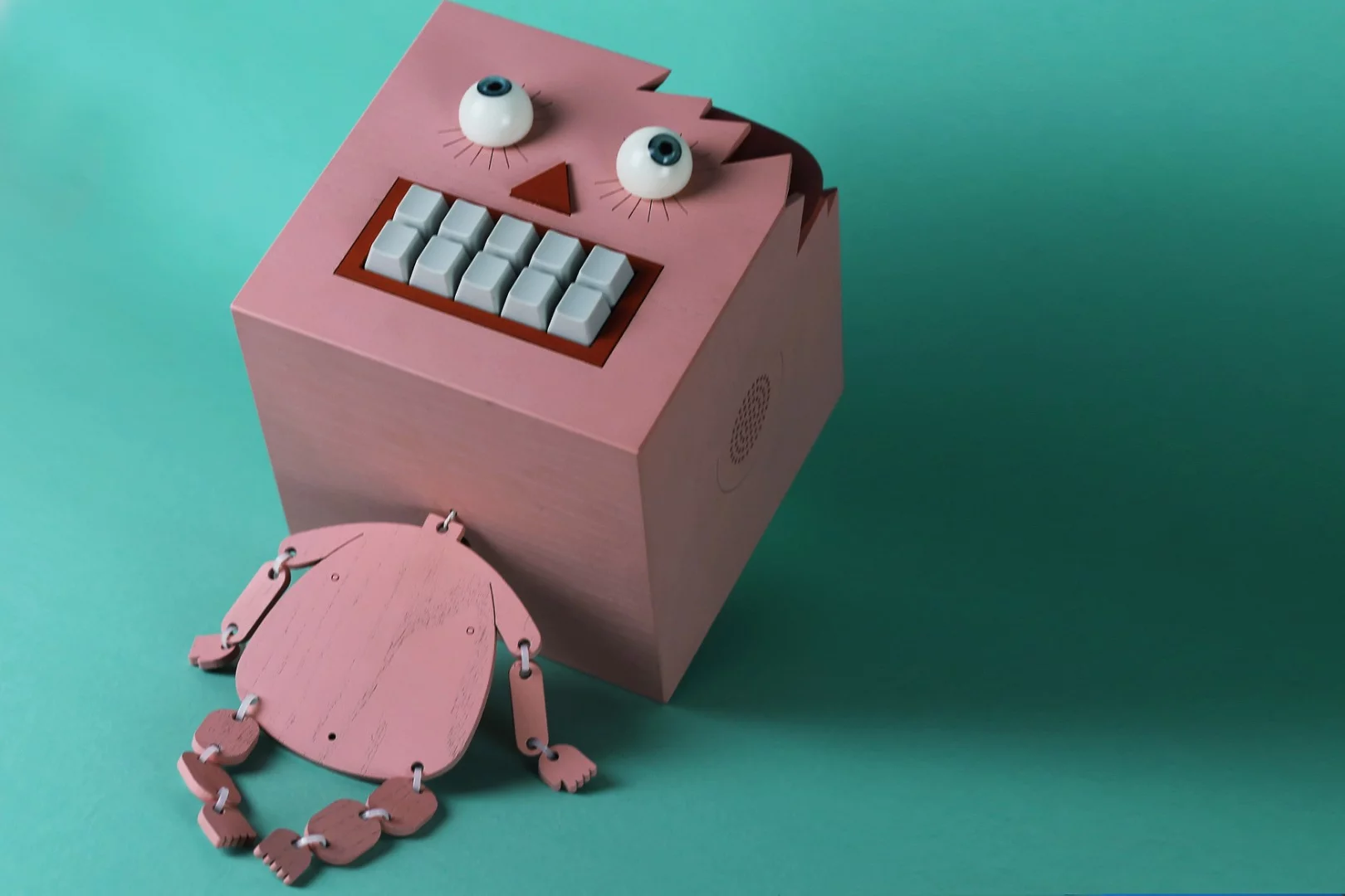 The battery-powered Mr Typo has a huge square head and a flat body hanging underneath, with links at the joints that flail and flop about when handled