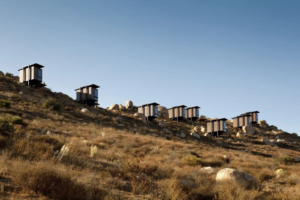 Designed by San Diego based architects Gracia Studio, each cabin is set privately along the sloping hillside