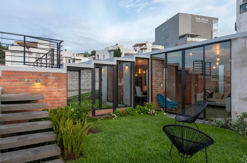 Three separate buildings are interconnected through interior and exterior pathways