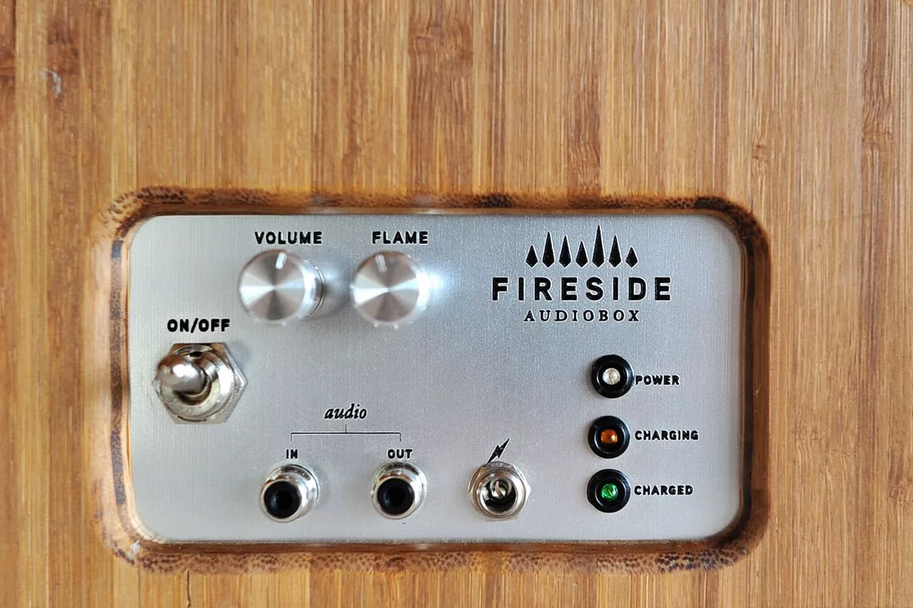 A control panel in the back switches on the device, and provides volume and flame intensity controls