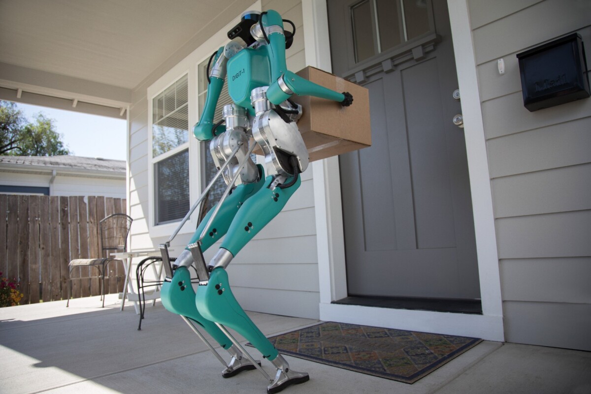 Ford imagines Digit delivering packages to a customer's door from an autonomous delivery vehicle
