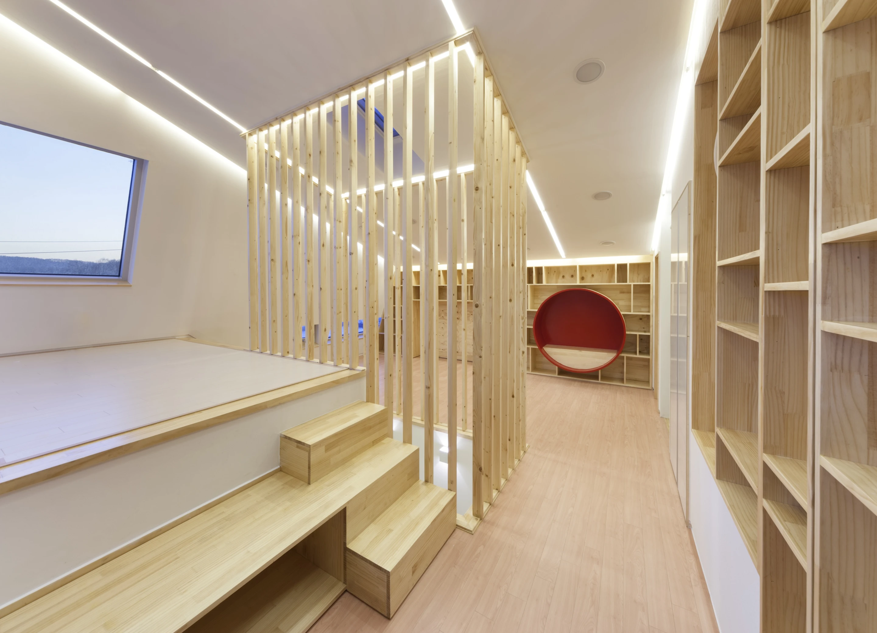 The first two floors comprise the home's living quarters, bathroom and kitchen, but the third floor is given over to play (Photo: Namgoong Sun)
