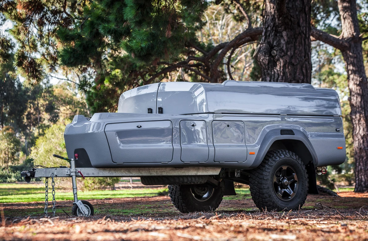 The Kerfton trailer is sleek, glossy composite body up high, stout galvanized steel frame below