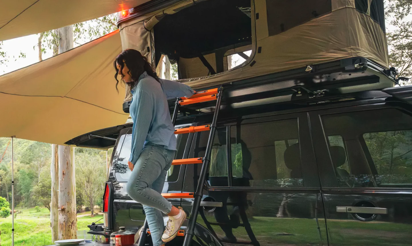 The integrated mounting track on the base edge secures the ladder and accessories like a shoe bag or awning extension