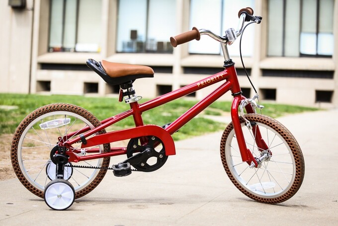 Features include air-free tires, a seat handle and tool-free training wheel adjustment