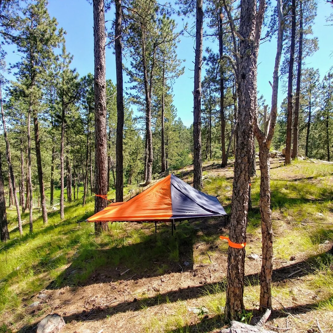 The Bivymok system can be suspended from trees to lift campers off the ground