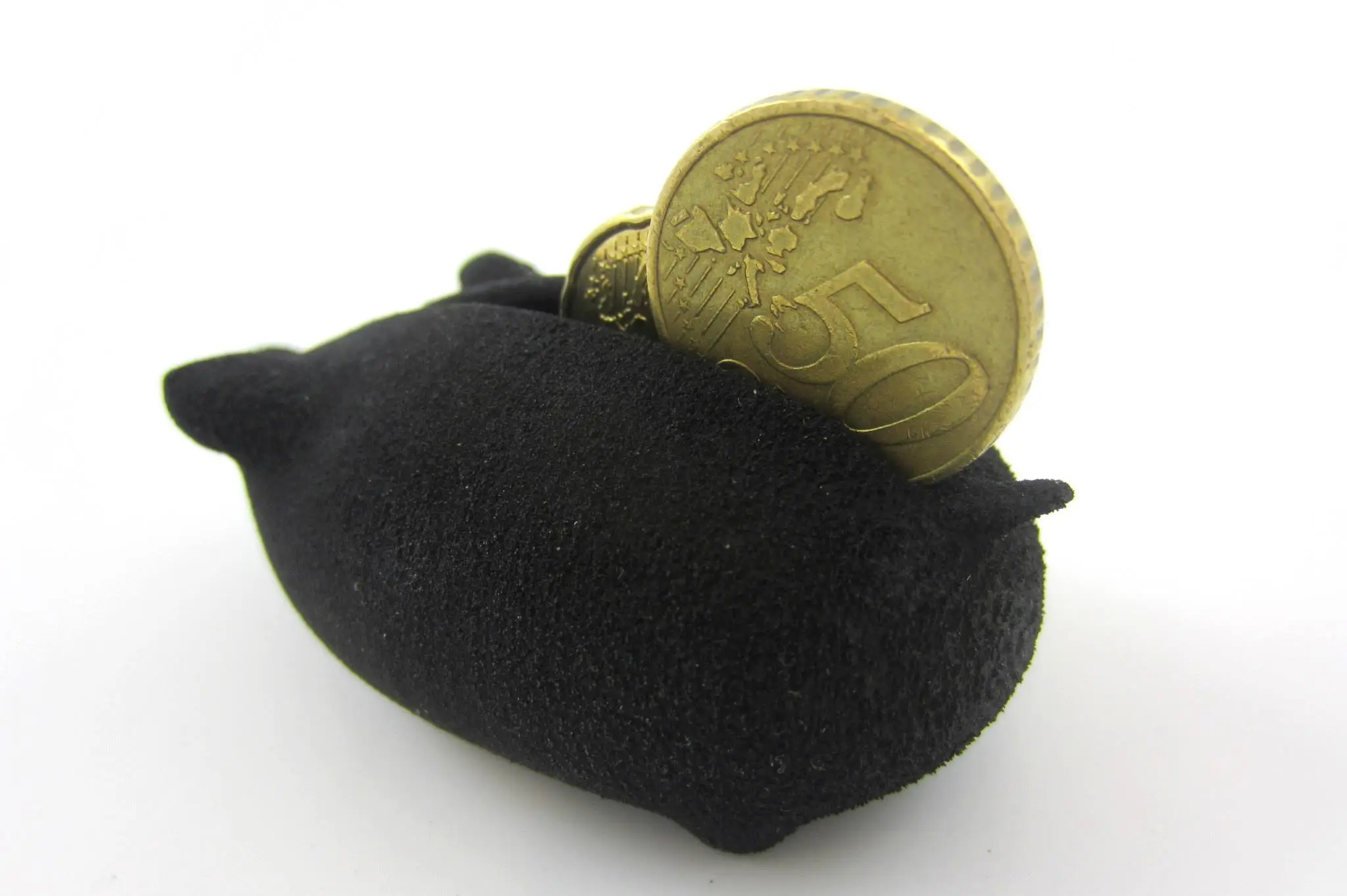 The Rubber-like material conforms to coins of different sizes