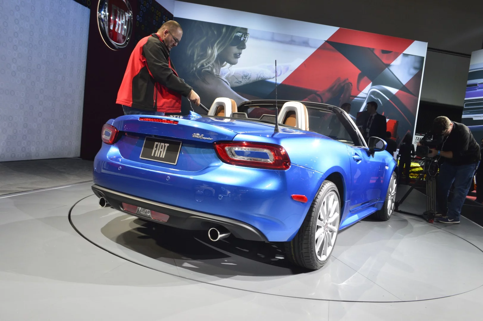 A ducktail spoiler and jutting tailpipes adorn the rear end