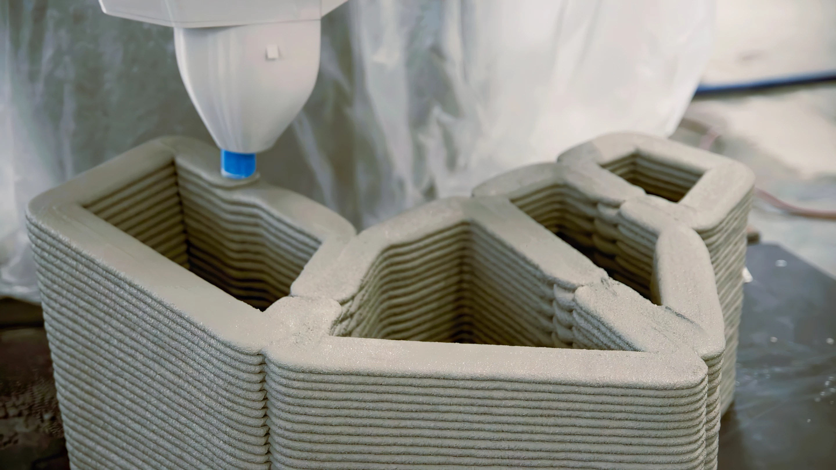 Phoenix's blocks were produced by a 3D printer, which extruded a cement-based mixture into layers to build up their structure