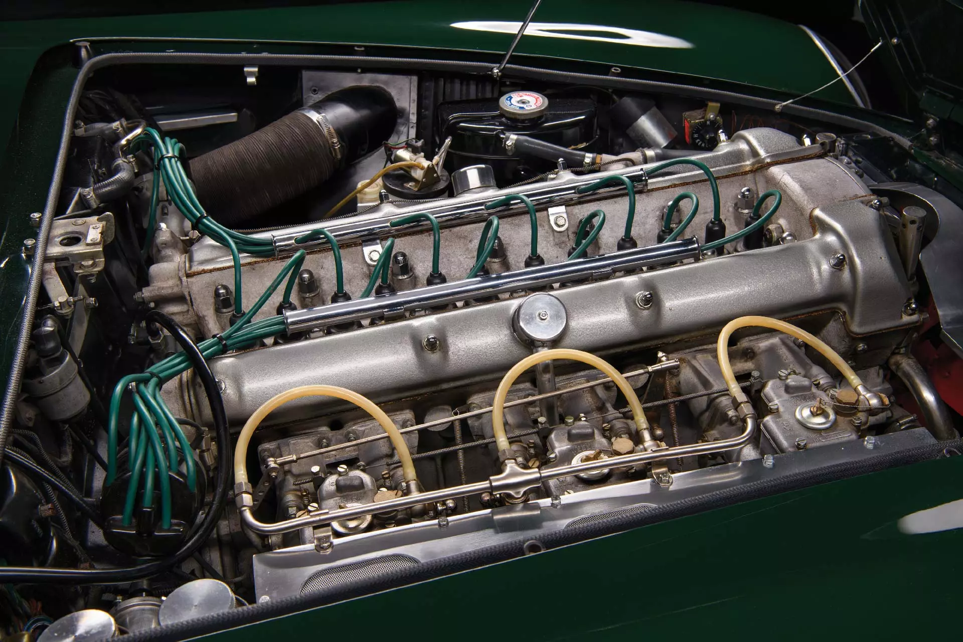 The 4.0-litre engine in this car was factory fitted in March 1963, with the official service records for the car noting that ‘repairs carried out following fire.’ Aston Martin’s engine shop records note that the engine was part of a sequence built for the Lagonda Rapide. The remainder of the engine, with the exception of the block, remains original as it left the factory in 1961.