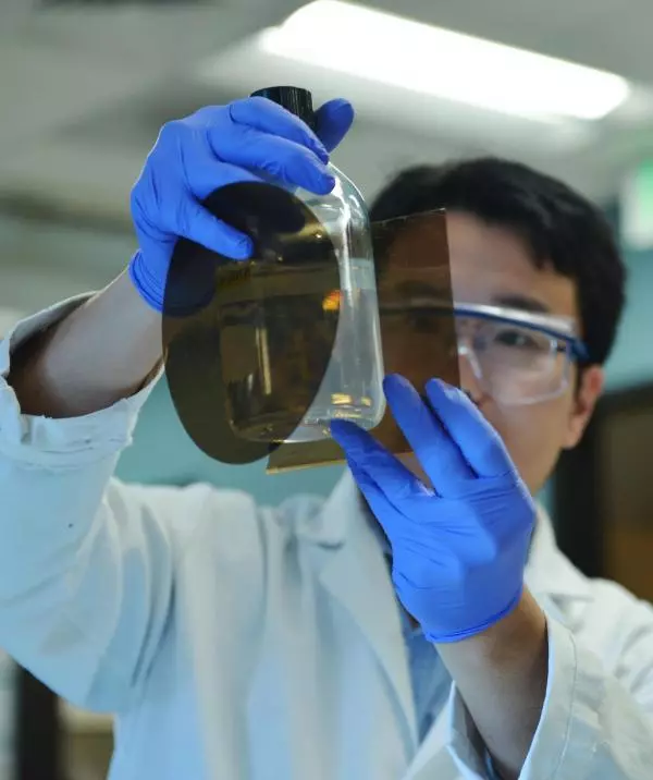 Researcher Qingkun Liu holding up cellulose, which has been produced from beer wort and is used to make the new transparent aerogel