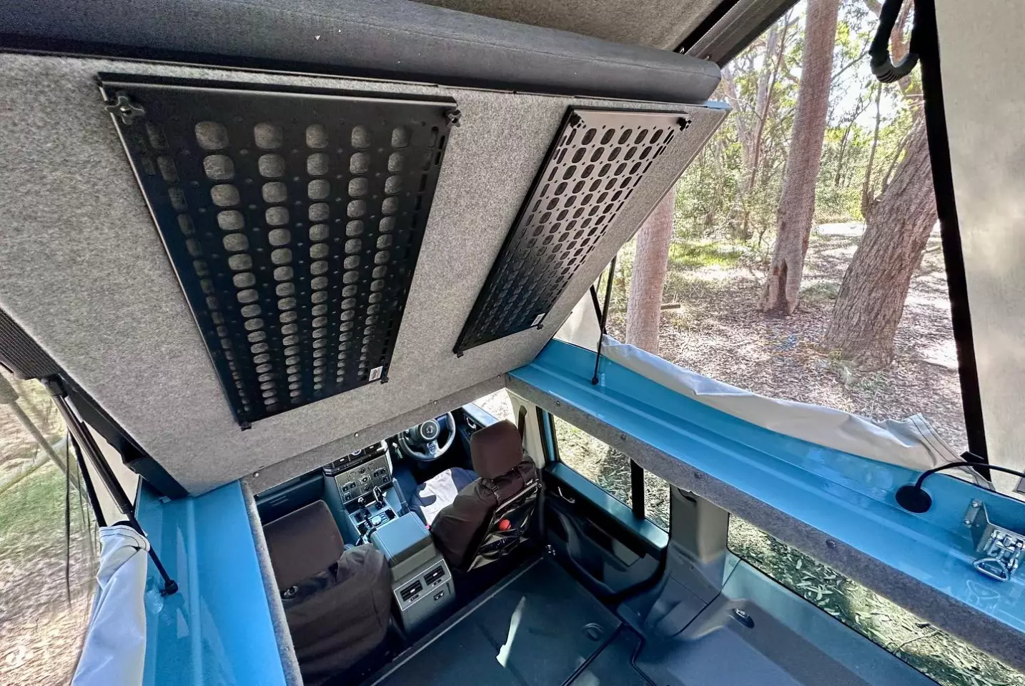 The Mulgo pop-top opens up standing height in the Grenadier when the sleeping platform is lifted