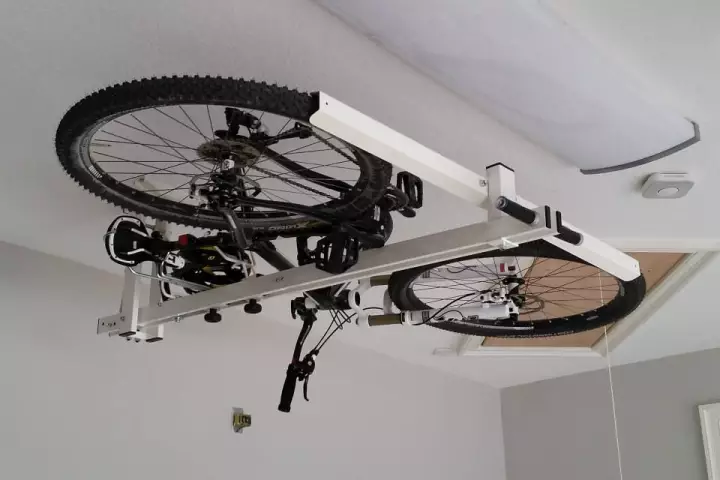 The flat-bike-lift utilizes pneumatic and hydraulic pistons, to make the pushing and pulling easier